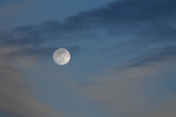 Desert moon rising up close.