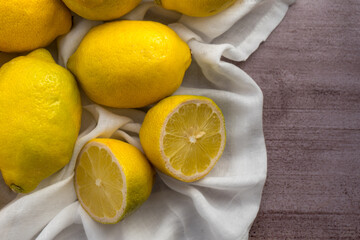Sliced yellow lemon with white linen 