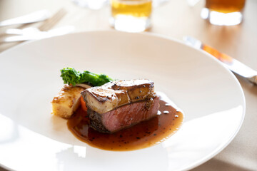 Foie gras on top of sautéed beef