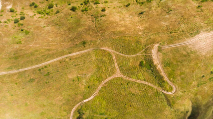 hilly landscape. Beautiful view with hills, clouds and trees. The nature.