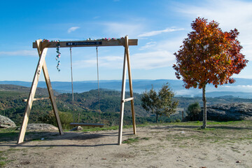 Fototapeta na wymiar Giant swing on the mountains