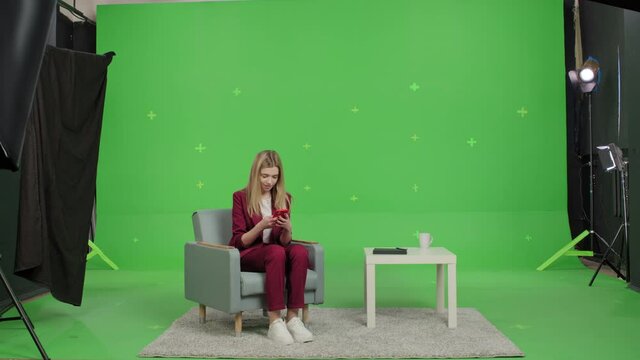 Portrait of happy business woman enjoy success on mobile phone at home office. Closeup joyful girl reading good news on phone over green screen . Surprised female celebrating victory