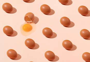 Easter pattern made of natural eggs on pastel orange background. Creative spring concept. Top view. Flat lay.