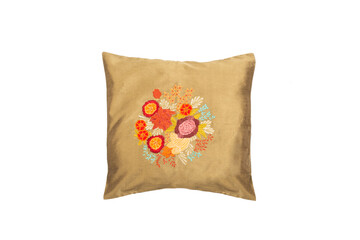Decorative, golden soft pillow with embroidered flowers, isolated on white background