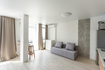 Small kitchenette in a studio, interior lighting.