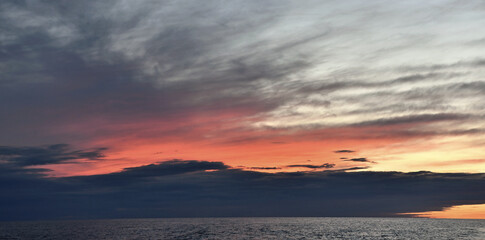 Sunset cloudscape. Light of nature colorful sky. Rjussia. Ladoga lake.