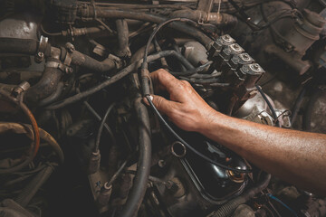 auto repair under the hood male hands dirty