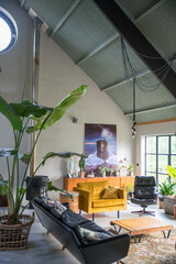 Trendy interior with midcentury modern vintage furniture. Big houseplants , sofa and couch. High...