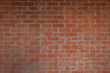 Old red brick wall texture background. Home or office design backdrop pattern.