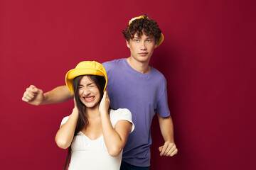 nice guy and girl stand side by side fashion modern style home fun red background