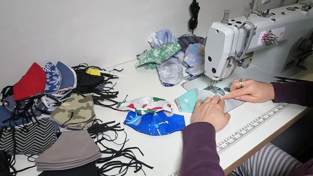 Sewing masks on a sewing machine.  
