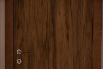 Brown wooden door with a handle
