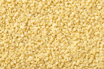 Hulled hemp seeds background, full frame, top view