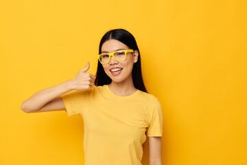 pretty brunette in glasses gesturing with hands copy-space isolated background unaltered