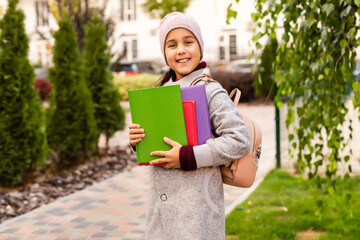 little girl with a backpack going to school