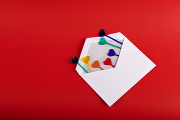 hearts in a white envelope on a red background