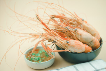Boiled shrimp in bowl with spicy sauce