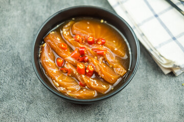 Fresh salmon raw pickled in shoyu sauce or soy sauce