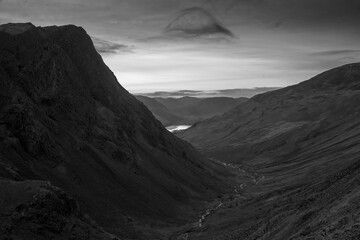 Black and white Stunning colorful landscape image of view down Honister Pass to Buttermere from Dale Head in Lake District during Autumn sunset
