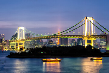 Tokyo Tower and Rainbow Bridge illumination at Sunset, Odaiba, Tokyo, Japan
