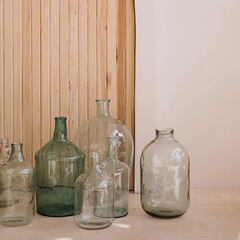 Home interior decoration. Vintage bottles against wooden wall