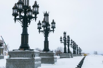 Fototapeta na wymiar Beautiful stunning row of lampposts in winter