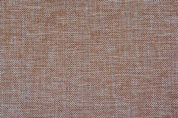 The pattern of beige matting fabric as a background for the design. Abstract texture of natural fabric.