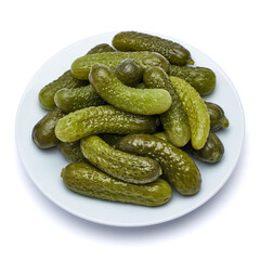 Plate of Tasty canned Whole green cornichons isolated on a white background