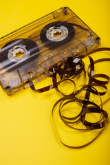 Vintage audio cassette and untwisted tape.