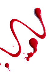 Attractive abstract background: spilled red nail polish, a few strokes and drops