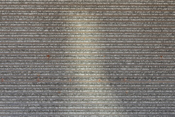 Close-up silver metal profile of an industrial building