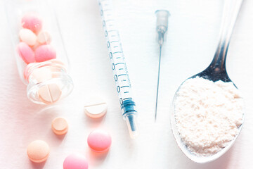 drug pills and syringe closeup