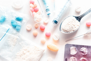 Obraz na płótnie Canvas drugs powder, pills, syringe and money addiction concept