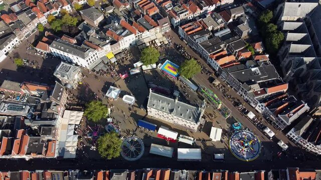 Aerial view of fair at downtown Gouda is town in west of Netherlands between Rotterdam and Utrecht in province of South Holland and is famous for its cheese stroopwafels grachten and its city hall 4k