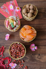 Popular street snacks during the festive seasons.Chinese New Year Sweet Delicacies. Favorites with children, dried longans, melon seeds, flavored sweets, chewy sweets, candied coconut flakes.