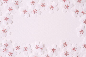 Fototapeta na wymiar Cherry blossom petal paper crafts on white textured paper background for wall paper. Blank for copy space.