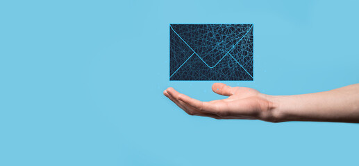 Businessman hand holding letter icon,email icons.Contact us by newsletter email and protect your...