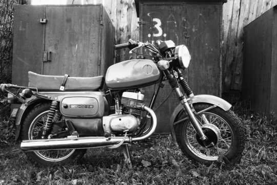 MINSK, BELARUS - SEPTEMBER 22, 2013: Old Russian Soviet Motorcycle Generic Motorbike "Voshod" Parked Outdoor. This motorcycles produced at Degtyarev plant in Russian town Kovrov since 1965.