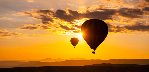 Sunrise balloon flight in Cappadocia with amazing sky and great colors. Visit the landmarks of Turkey.