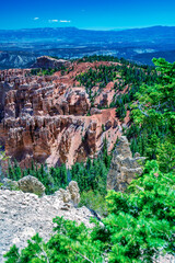 Aerial view of Bryce Canyon on a beautiful summer day. Overlook of orange colorful hoodoos red rock formations in Bryce Canyon National Park, Utah - USA.