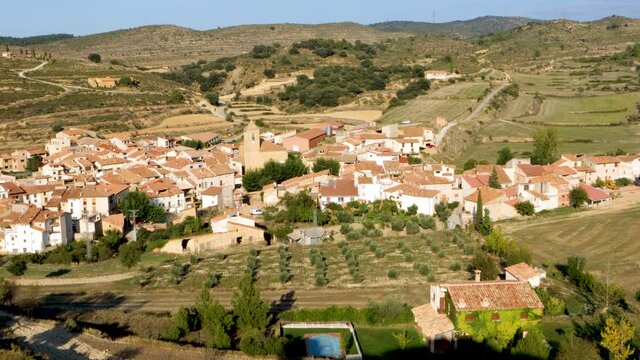 Las Parras de Castellote with its parish church of San Nicolas of Bari, beautiful village in the interior and rural Spain in Bajo Aragon, Spain.