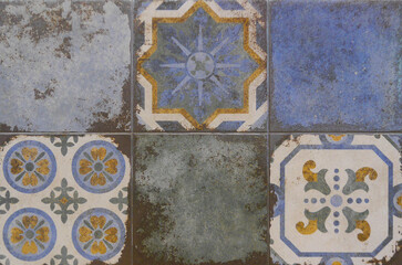 Tile texture on the wall. Decorative insert. Mosaic art. Roman style. Architectural tile insert