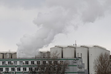 smoking factory with different buildings
