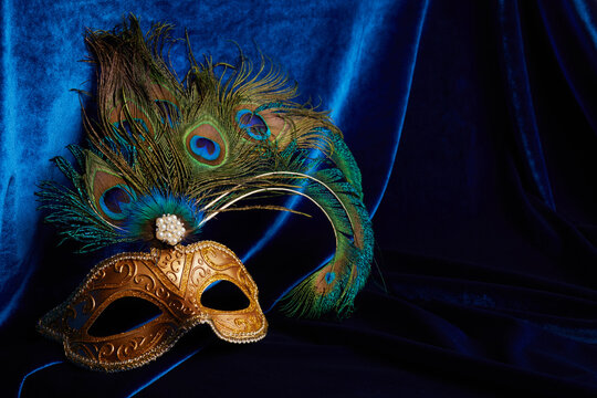 Luxury venetian mask on dark blue background. Carnival masquerade fantasy mask