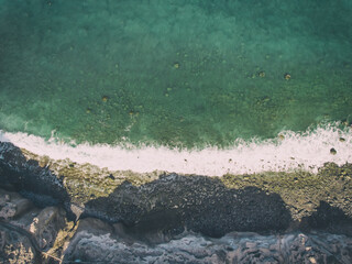 Overhead aerial view of Tenerife black beach from drone, Tenerife