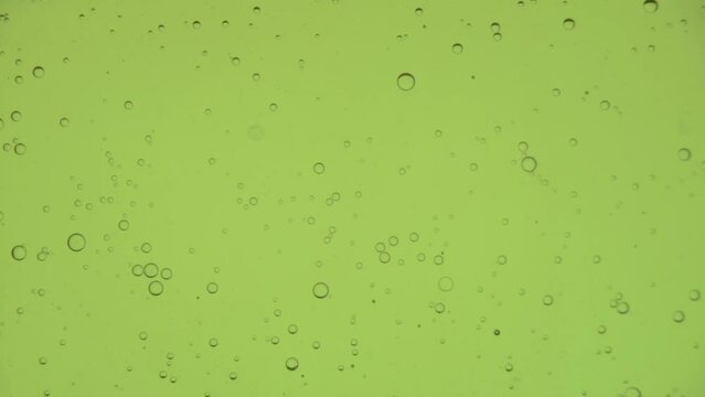Oil bubbles in slow motion, gradient lighting, macro