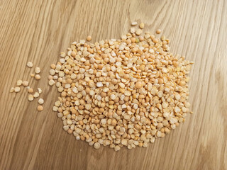 Dried split peas on wooden table 