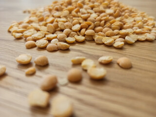 Dried split peas on wooden table