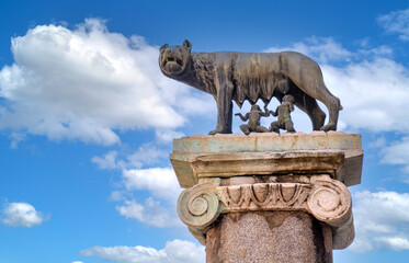 Capitoline Wolf Lupa Capitolina replica statue aside Palazzo Senatorio Senate Palace and Capitoline Museum at Campidoglio square in historic city center of Rome in Italy - 481986730