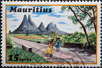 Mauritius - circa 1971 : a postage stamp from Mauritius shows a tourist island scenery with...